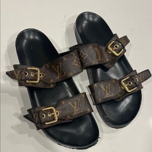 Authentic Louis Vuitton Brown Monogram Slides. heavy bottom wear. size 7
